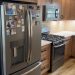 'Before' image of outdated kitchen before a remodel.
