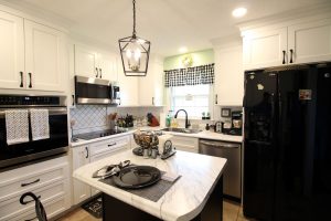 Bright white cabinets with complimentary black and stainless steel appliances