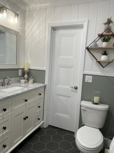 Beautiful farmhouse bathroom with wood paneling walls